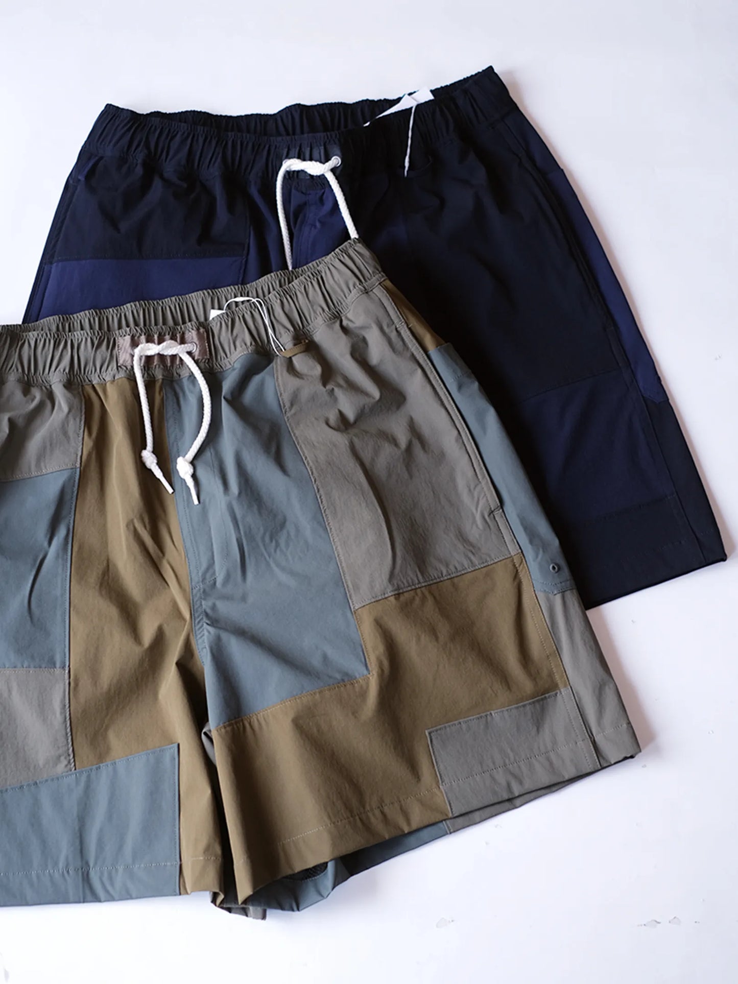 UNFRM "2WAY STRETCH PATCHWORK BAGGY SHORTS(2colors)"