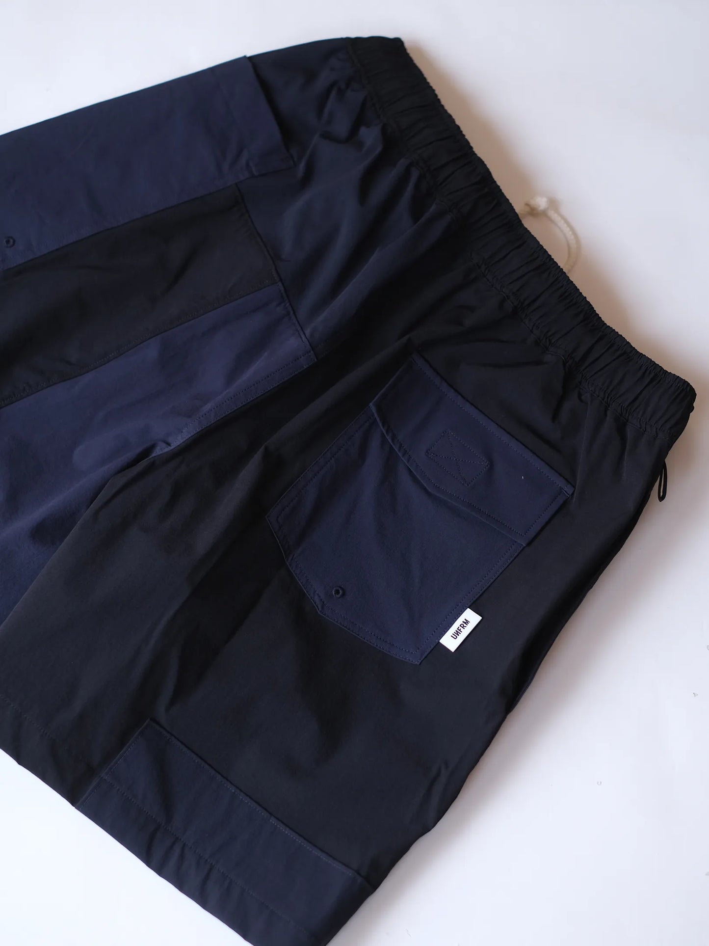 UNFRM "2WAY STRETCH PATCHWORK BAGGY SHORTS(2colors)"
