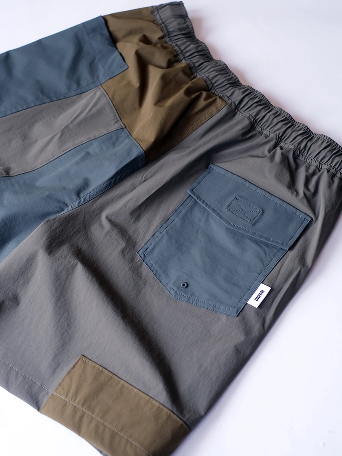 UNFRM "2WAY STRETCH PATCHWORK BAGGY SHORTS(2colors)"