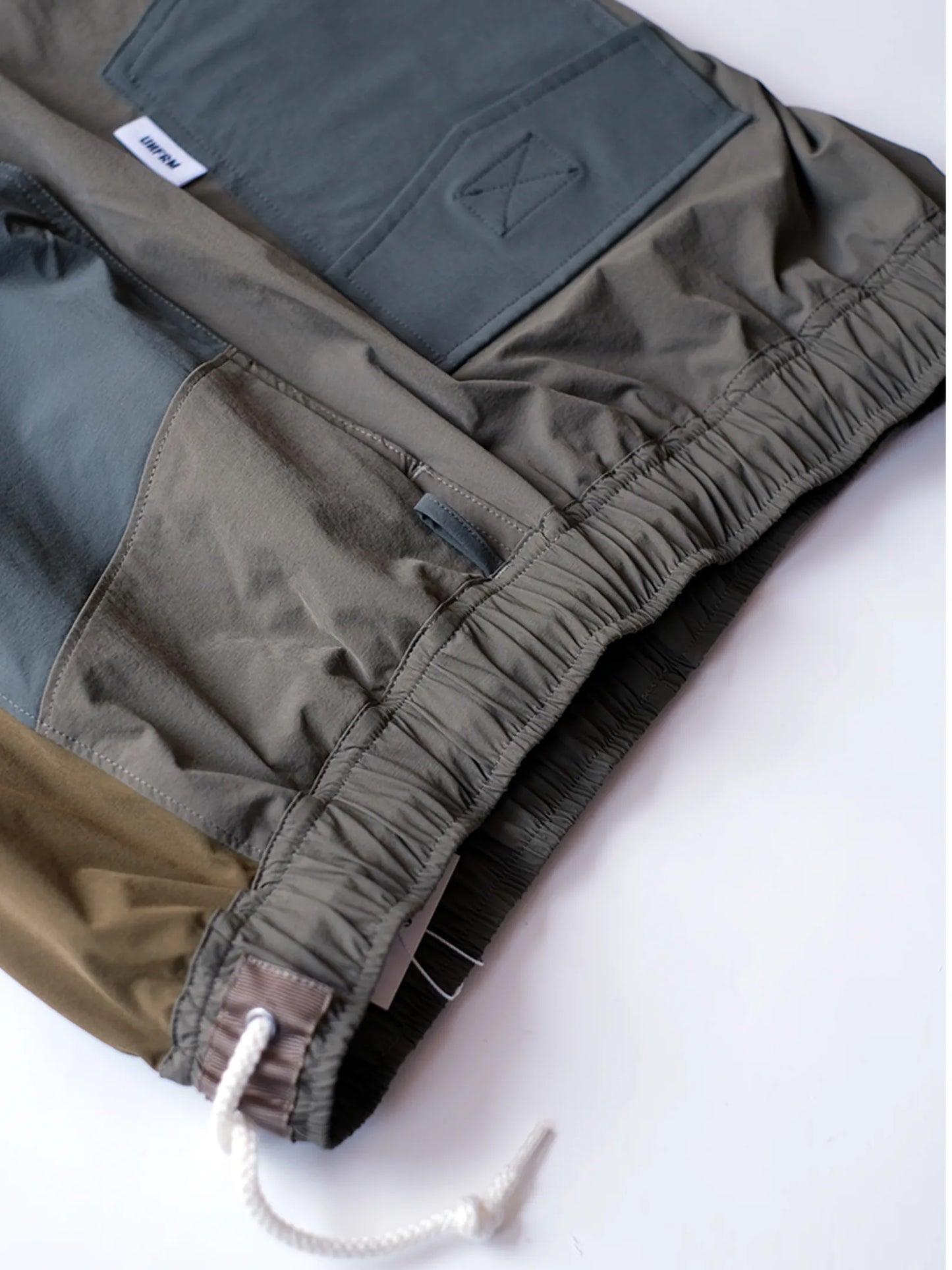 UNFRM "2WAY STRETCH PATCHWORK BAGGY SHORTS(2colors)"