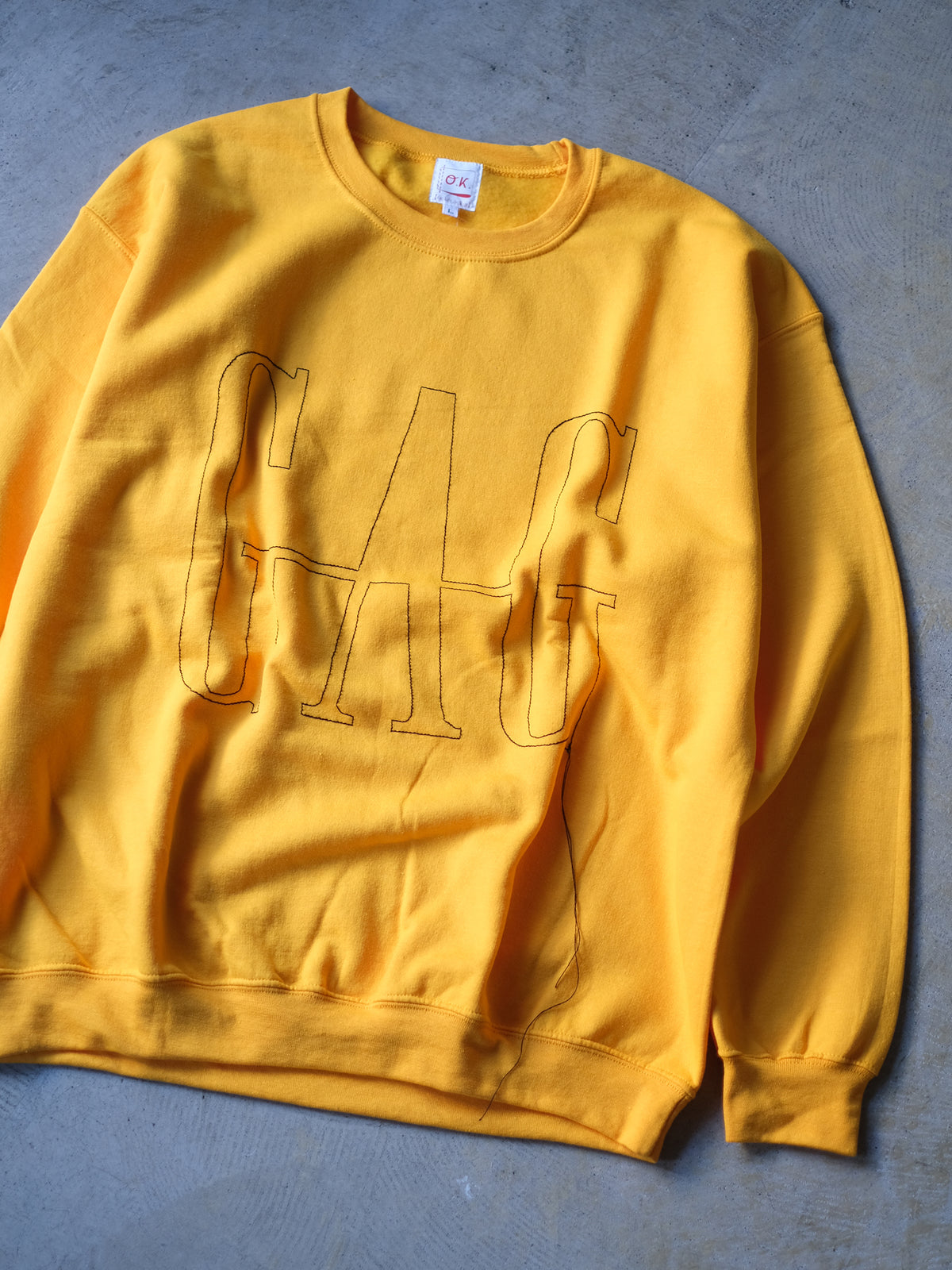 O.K. "『GAG』一筆描きステッチ　CREW SWEAT(2colors)"
