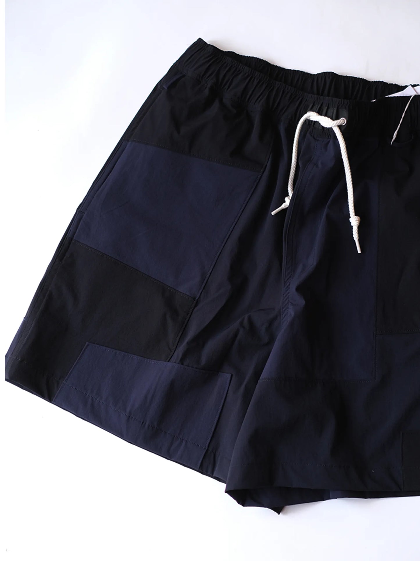 UNFRM "2WAY STRETCH PATCHWORK BAGGY SHORTS(2colors)"